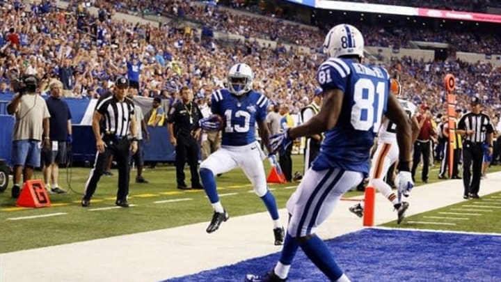 Aug 24, 2013; Indianapolis, IN, USA; Indianapolis Colts wide receiver T.Y. Hilton (13) scores a touchdown after getting past Cleveland Browns defensive back Buster Skrine (22) at Lucas Oil Stadium. Mandatory Credit: Brian Spurlock-USA TODAY Sports