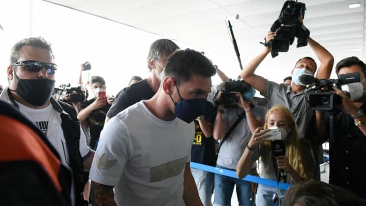 Barcelona's departing Argentinian forward Lionel Messi arrives at El Prat airport in Barcelona on August 10, 2021. - France is waiting impatiently for Lionel Messi with supporters gathering outside Paris Saint-Germain's ground hoping to see the Argentine who is expected to join the Qatar-owned club after his exit from Barcelona. (Photo by Josep LAGO / AFP) (Photo by JOSEP LAGO/AFP via Getty Images)