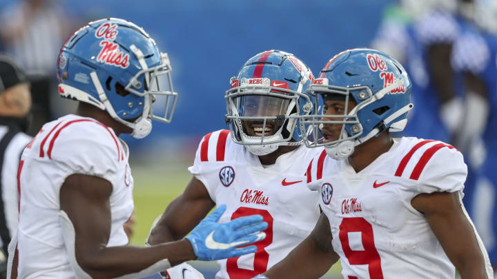 Oct 3, 2020; Lexington, Kentucky, USA; Mississippi Rebels wide receiver Elijah Moore (8) celebrates after a Mississippi touchdown in the second half against Kentucky at Kroger Field. Mandatory Credit: Katie Stratman-USA TODAY Sports