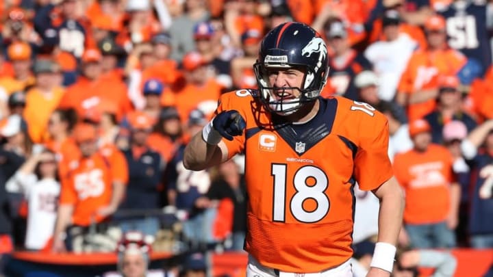 Jan 19, 2014; Denver, CO, USA; Denver Broncos quarterback Peyton Manning (18) signals in the first half during the 2013 AFC Championship game at Sports Authority Field against the New England Patriots at Mile High. Mandatory Credit: Matthew Emmons-USA TODAY Sports