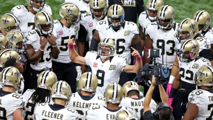 New Orleans Saints quarterback Drew Brees (9) talks to teammates before their game – Mandatory Credit: Chuck Cook-USA TODAY Sports
