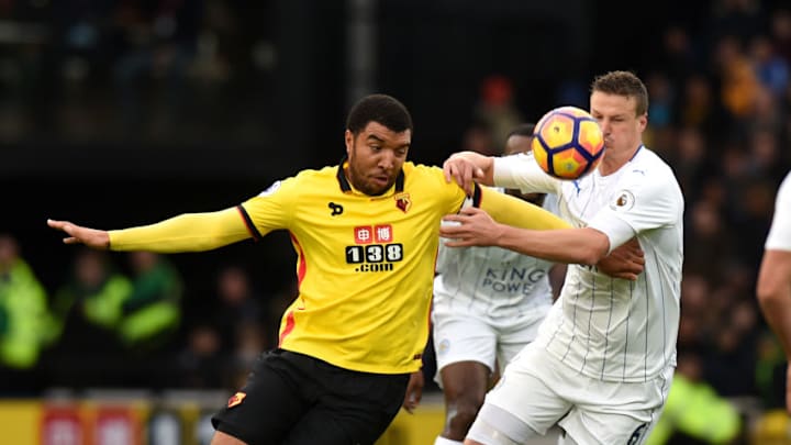 WATFORD, ENGLAND - NOVEMBER 19: Troy Deeney of Watford holds off a challenge from Robert Huth of Leicester City during the Premier League match between Watford and Leicester City at Vicarage Road on November 19, 2016 in Watford, England. (Photo by Tony Marshall/Getty Images)