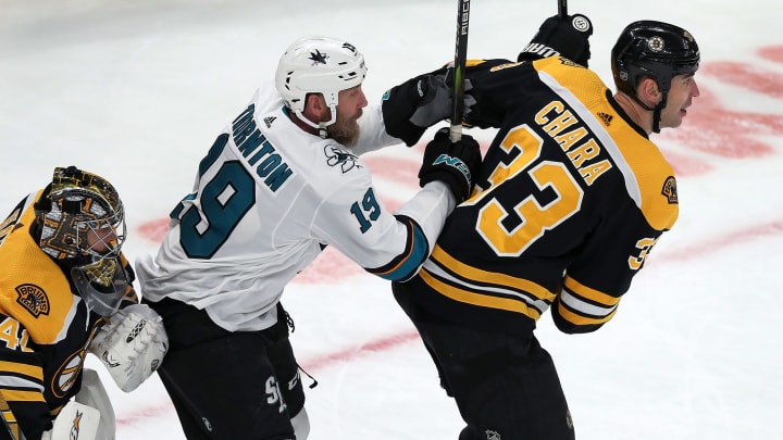 BOSTON - FEBRUARY 26: San Jose Sharks' Joe Thornton (19) battles the Bruins' Zdeno Chara (33) for position in front of Bruins goalie Jaroslav Halak, left, during the first period. The Boston Bruins host the San Jose Sharks in a regular season NHL hockey game at TD Garden in Boston on Feb. 26, 2019. (Photo by Jim Davis/The Boston Globe via Getty Images)