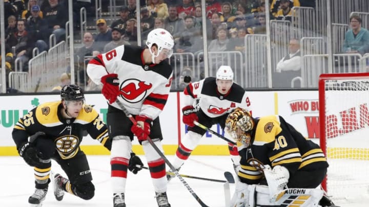 BOSTON, MA - OCTOBER 12: Boston Bruins goalie Tuukka Rask (40) stops New Jersey Devils center Jack Hughes (86) during a game between the Boston Bruins and the New Jersey Devils on October 12, 2019, at TD Garden in Boston, Massachusetts. (Photo by Fred Kfoury III/Icon Sportswire via Getty Images)