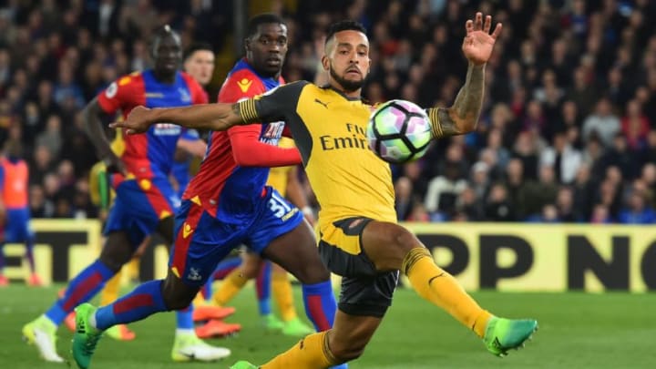 Arsenal's English midfielder Theo Walcott controls the ball during the English Premier League football match between Crystal Palace and Arsenal at Selhurst Park in south London on April 10, 2017. / AFP PHOTO / Glyn KIRK / RESTRICTED TO EDITORIAL USE. No use with unauthorized audio, video, data, fixture lists, club/league logos or 'live' services. Online in-match use limited to 75 images, no video emulation. No use in betting, games or single club/league/player publications. / (Photo credit should read GLYN KIRK/AFP/Getty Images)