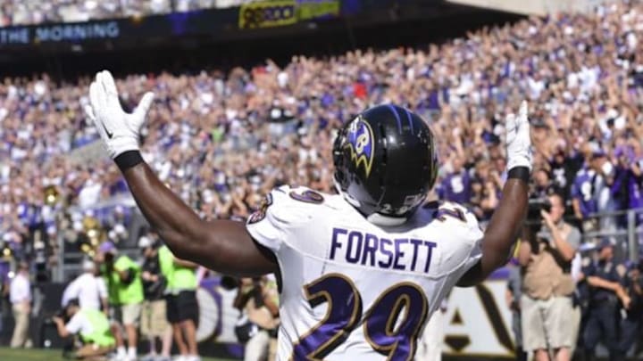 Sep 7, 2014; Baltimore, MD, USA; Baltimore Ravens running back Justin Forsett (29) celebrates after scoring a 13-yard touchdown during the third quarter against the Cincinnati Bengals at M&T Bank Stadium. Mandatory Credit: Tommy Gilligan-USA TODAY Sports