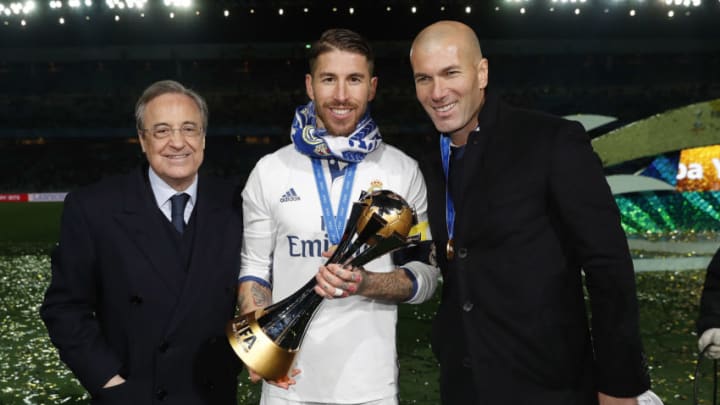 YOKOHAMA, JAPAN - DECEMBER 18: (L-R) President Florentino Perez, Sergio Ramos and head coach Zinedine Zidane of Real Madrid pose with the trophy after the FIFA Club World Cup Final match between Real Madrid and Kashima Antlers at International Stadium Yokohama on December 18, 2016 in Yokohama, Japan. (Photo by Angel Martinez/Real Madrid via Getty Images)