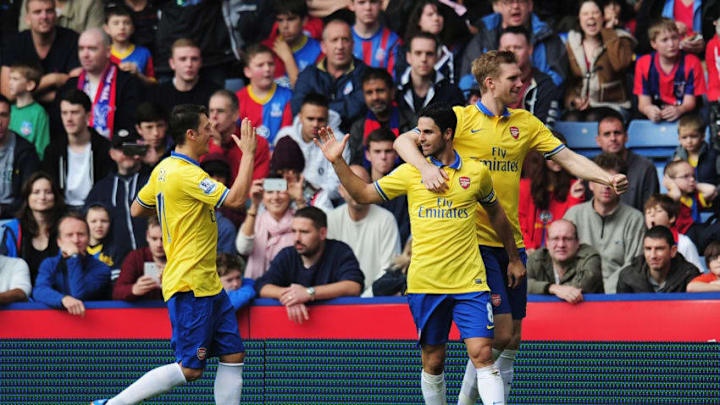 LONDON, ENGLAND - OCTOBER 26: Mikel Arteta (2ndR) of Arsenal celebrates scoring his penalty with Mesut Oezil (L) and Per Mertesacker (R) during the Barclays Premier League match between Crystal Palace and Arsenal at Selhurst Park on October 26, 2013 in London, England. (Photo by Shaun Botterill/Getty Images)