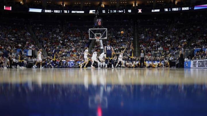 Mar 18, 2022; Pittsburgh, PA, USA; Chattanooga Mocs guard Malachi Smith (13) shoots over Illinois Fighting Illini guard Andre Curbelo (5) in the second half during the first round of the 2022 NCAA Tournament at PPG Paints Arena. Mandatory Credit: Geoff Burke-USA TODAY Sports