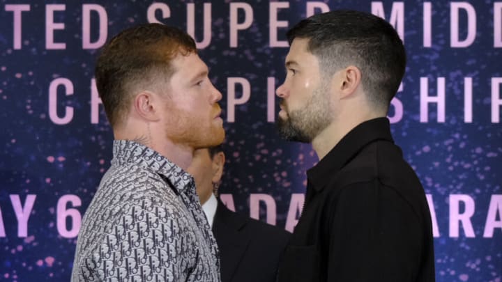 ZAPOPAN, MEXICO - MARCH 14: Saul Canelo Alvarez (L) and John Ryder (R) face off during the press conference at Akron Stadium on March 14, 2023 in Zapopan, Mexico. Canelo Alvarez will fight against John Ryder on May 6, 12 years after his last combat in Mexico. The event will take place at Akron Stadium. (Photo by Alfredo Moya/Jam Media/Getty Images)