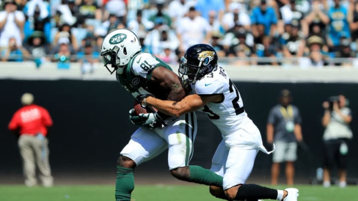 JACKSONVILLE, FL - SEPTEMBER 30: Tyler Patmon #23 of the Jacksonville Jaguars attempts to tackle Quincy Enunwa #81 of the New York Jets during the game on September 30, 2018 in Jacksonville, Florida. (Photo by Sam Greenwood/Getty Images)
