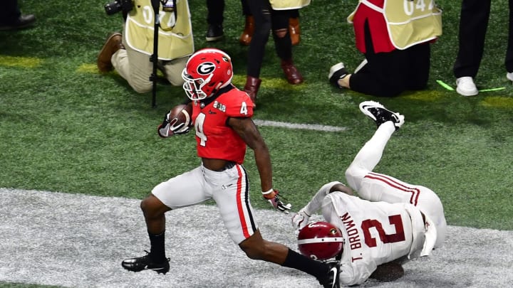 ATLANTA, GA – JANUARY 08: Mecole Hardman #4 of the Georgia Bulldogs runs with a catch for a touchdown against Tony Brown #2 of the Alabama Crimson Tide in the CFP National Championship presented by AT&T at Mercedes-Benz Stadium on January 8, 2018 in Atlanta, Georgia. (Photo by Scott Cunningham/Getty Images)