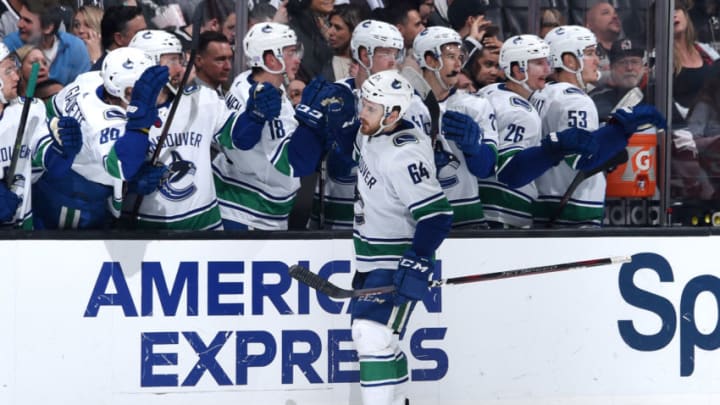 LOS ANGELES, CA - NOVEMBER 24: Tyler Motte #64 of the Vancouver Canucks celebrates with the bench after scoring a third-period empty-net goal during the game against the Los Angeles Kings at STAPLES Center on November 24, 2018 in Los Angeles, California. (Photo by Adam Pantozzi/NHLI via Getty Images)