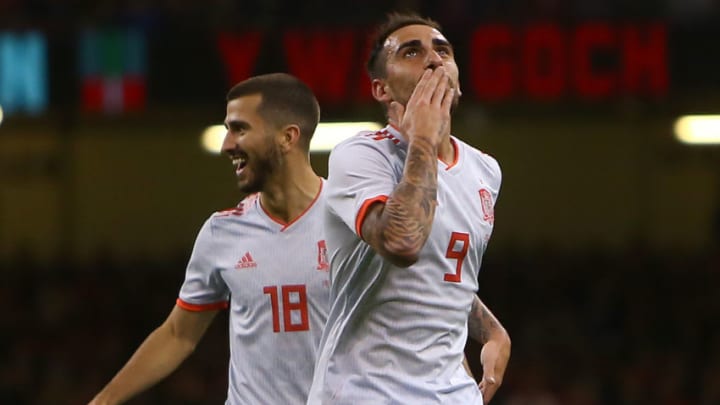 Spain's striker Paco Alcacer (R) celebrates scoring the opening goal during the international friendly football match between Wales and Spain at The Principality Stadium in Cardiff, south Wales, on October 11, 2018. (Photo by GEOFF CADDICK / AFP) (Photo credit should read GEOFF CADDICK/AFP/Getty Images)