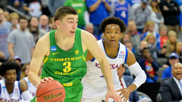 Mar 25, 2017; Kansas City, MO, USA; Oregon Ducks guard Payton Pritchard (3) drives ahead of Kansas Jayhawks guard Devonte’ Graham (4) during the first half in the finals of the Midwest Regional of the 2017 NCAA Tournament at Sprint Center. Mandatory Credit: Denny Medley-USA TODAY Sports