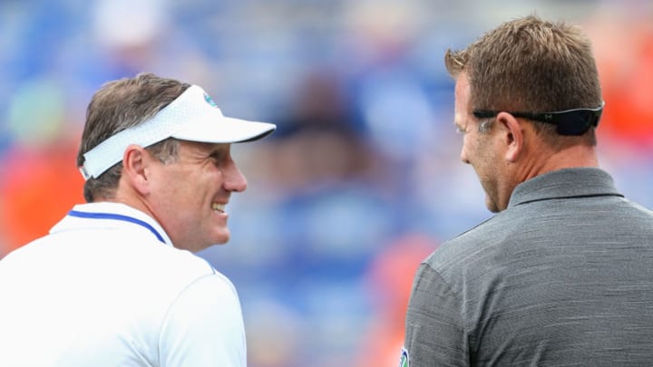 GAINESVILLE, FLORIDA - SEPTEMBER 28: Head coaches Dan Mullen of the Florida Gators and Rob Ambrose of the Towson Tigers meet before the start of a game at Ben Hill Griffin Stadium on September 28, 2019 in Gainesville, Florida. (Photo by James Gilbert/Getty Images)