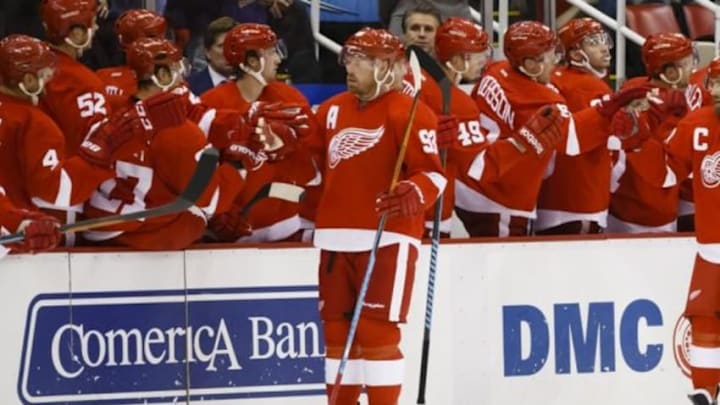 Oct 9, 2014; Detroit, MI, USA; Detroit Red Wings left wing Johan Franzen (93) receives congratulations from teammates after scoring in the second period against the Boston Bruins at Joe Louis Arena. Mandatory Credit: Rick Osentoski-USA TODAY Sports