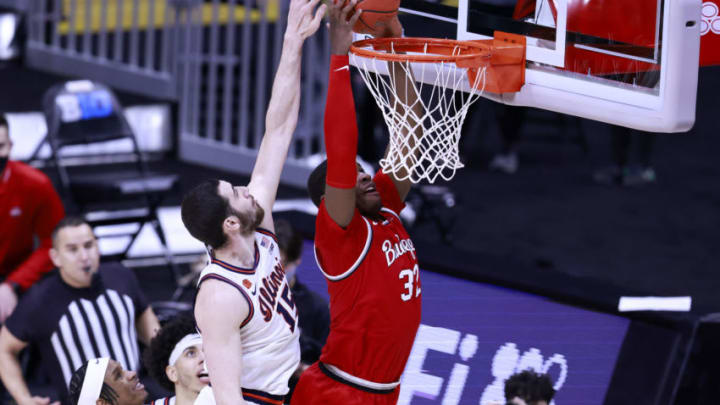 INDIANAPOLIS, INDIANA - MARCH 14: E.J. Liddell #32 of the Ohio State Buckeyes dunks the ball over Giorgi Bezhanishvili #15 of the Illinois Fighting Illini in the Big Ten Basketball Tournament championship at Lucas Oil Stadium on March 14, 2021 in Indianapolis, Indiana. (Photo by Justin Casterline/Getty Images)