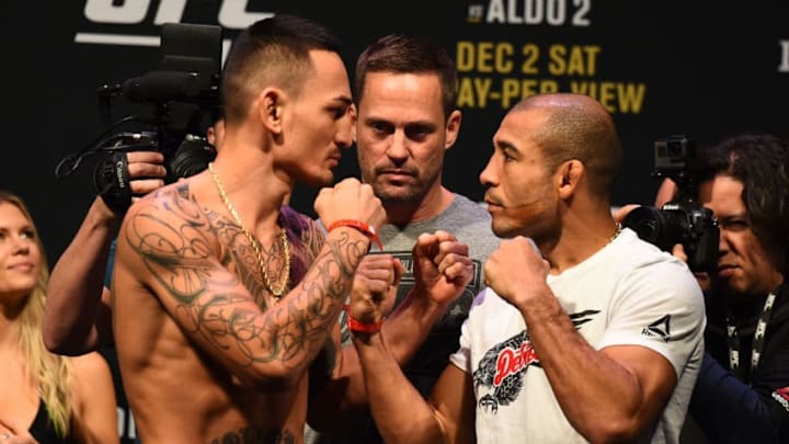 DETROIT, MI - DECEMBER 01: (L-R) Max Holloway and Jose Aldo of Brazil face off during the UFC 218 weigh-in inside Little Caesars Arena on December 1, 2017 in Detroit, Michigan. (Photo by Josh Hedges/Zuffa LLC/Zuffa LLC via Getty Images)