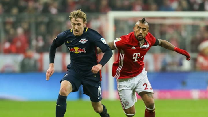 MUNICH, GERMANY - DECEMBER 21: Arturo Erasmo Vidal of Muenchen and Emil Forsberg of Leipzig battle for the ball during the Bundesliga match between Bayern Muenchen and RB Leipzig at Allianz Arena on December 21, 2016 in Munich, Germany. (Photo by TF-Images/Getty Images)