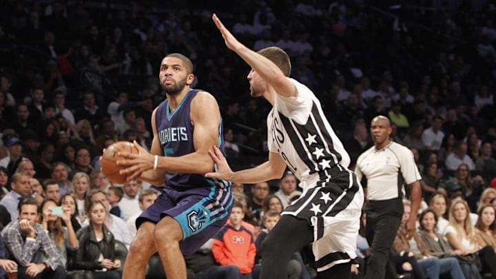 Nov 4, 2016; Brooklyn, NY, USA; Charlotte Hornets guard Nicolas Batum (5) looks to put up a shot against Brooklyn Nets guard Joe Harris (12) in the second quarter at Barclays Center. Mandatory Credit: Nicole Sweet-USA TODAY Sports