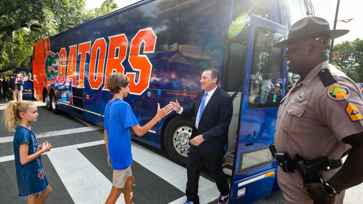 Florida Gators head coach Dan Mullen greets his son Canon Mullen and daughter Breelyn after the Florida Gators arrived for Gator Walk as they were greeted by fans before playing the Tennessee Volunteers Saturday September 25, 2021 at Ben Hill Griffin Stadium in Gainesville, FL. [Doug Engle/GainesvilleSun]2021Flgai 092521 Gatorsvsvolsgatorwalk