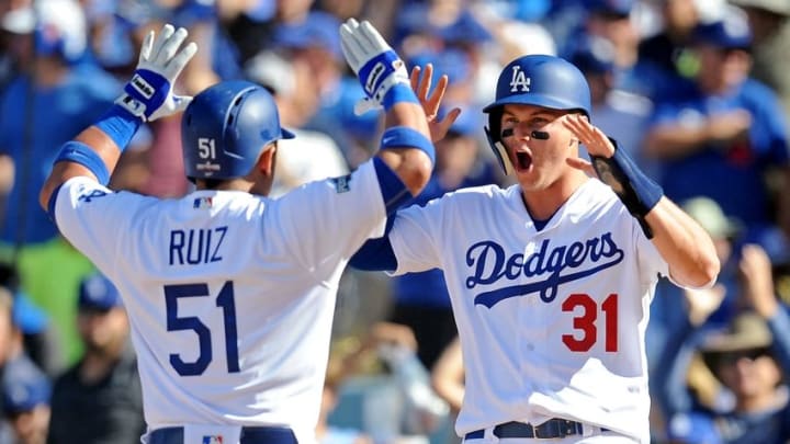 Oct 10, 2016; Los Angeles, CA, USA; Los Angeles Dodgers catcher Carlos Ruiz (51) celebrates with Los Angeles Dodgers center fielder Joc Pederson (31) after hitting a two run home run during the fifth inning against the Washington Nationals in game three of the 2016 NLDS playoff baseball series at Dodger Stadium. Mandatory Credit: Gary A. Vasquez-USA TODAY Sports