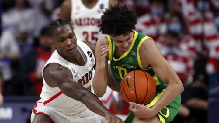 Feb 19, 2022; Tucson, Arizona, USA; Arizona Wildcats guard Bennedict Mathurin (0) tries to steal the ball from Oregon Ducks guard Will Richardson (0) during the second half at McKale Center. Mandatory Credit: Chris Coduto-USA TODAY Sports