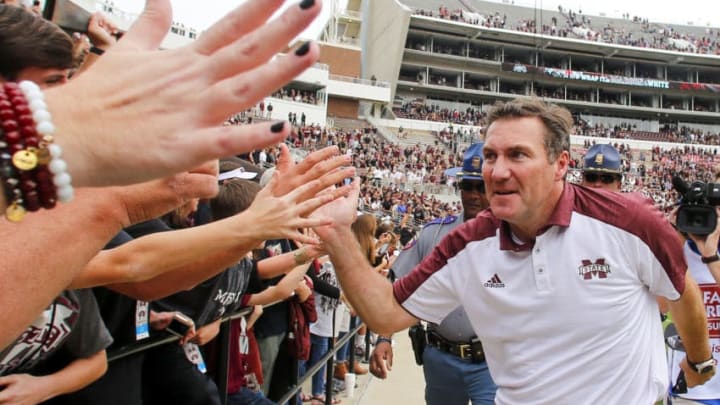 STARKVILLE, MS - NOVEMBER 5: Head coach Dan Mullen of the Mississippi State Bulldogs celebrates with fans after the end of an NCAA college football game at Davis Wade Stadium on November 5, 2016 in Starkville, Mississippi. Mississippi State beat the Texas A