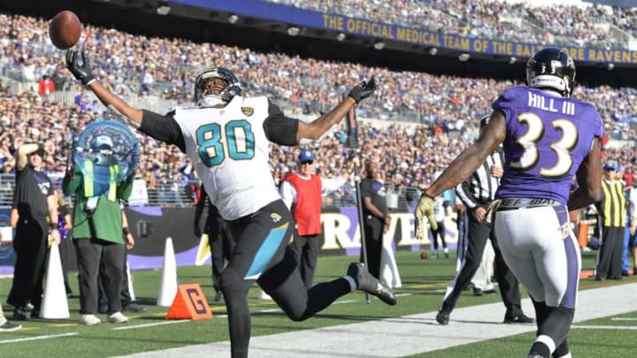 Nov 15, 2015; Baltimore, MD, USA; Jacksonville Jaguars tight end Julius Thomas (80) reaches for the ball in the end zone in front of as Baltimore Ravens strong safety Will Hill (33) during the second quarter at M&T Bank Stadium. Mandatory Credit: Tommy Gilligan-USA TODAY Sports