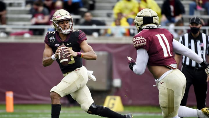 Apr 10, 2021; Tallahassee, Florida, USA; Florida State Seminoles quarterback Jordan Travis (13) runs the ball during the annual Garnet and Gold Spring Game at Doak Campbell Stadium. Mandatory Credit: Melina Myers-USA TODAY Sports