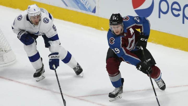 DENVER, CO - OCTOBER 24: Colorado Avalanche center Nathan MacKinnon (29) skates ahead of Tampa Bay Lightning defenseman Dan Girardi (5) during a regular season game between the Colorado Avalanche and the visiting Tampa Bay Lightning on October 24, 2018 at the Pepsi Center in Denver, CO. (Photo by Russell Lansford/Icon Sportswire via Getty Images)