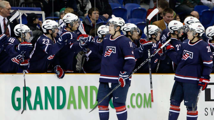 SASKATOON, SK – JANUARY 3: John Carlson #11 and Jeremy Morin #26 of Team USA celebrate a goal with team mates during the 2010 IIHF World Junior Championship Tournament Semifinal game against Team Sweden on January 3, 2010 at the Credit Union Centre in Saskatoon, Saskatchewan, Canada. Team USA defeated Team Sweden 5-2. (Photo by Richard Wolowicz/Getty Images)