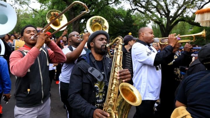 Apr 15, 2016; New Orleans, LA, USA; A second-line parade marches down Camp street near Half Moon Bay bar for a tribute march to the retired NFL athlete Will Smith memorial at Sophie B. Wright Place and Felicity Street. Smith was shot and killed late Saturday night at the memorial location after being involved in a minor traffic accident. Mandatory Credit: Derick E. Hingle-USA TODAY Sports
