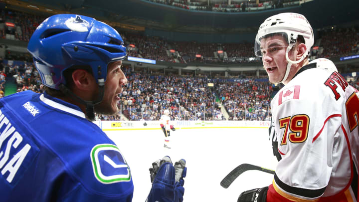 VANCOUVER, BC – APRIL 17: Kevin Bieksa #3 of the Vancouver Canucks and Michael Ferland of the Calgary Flames exchange words during Game Two of the Western Conference Quarterfinals during the 2015 NHL Stanley Cup Playoffs at Rogers Arena on April 17, 2015 in Vancouver, British Columbia, Canada. (Photo by Jeff Vinnick/NHLI via Getty Images)