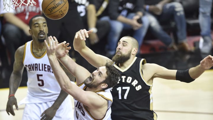 May 3, 2017; Cleveland, OH, USA; Cleveland Cavaliers forward Kevin Love (0) and Toronto Raptors center Jonas Valanciunas (17) reach for a rebound in the second quarter in game two of the second round of the 2017 NBA Playoffs at Quicken Loans Arena. Mandatory Credit: David Richard-USA TODAY Sports