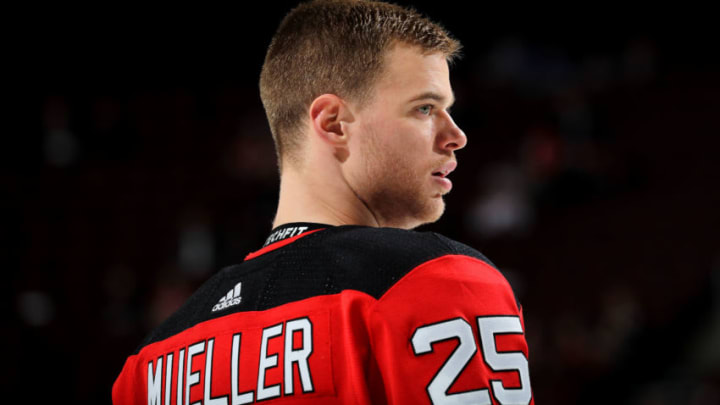 NEWARK, NEW JERSEY - APRIL 01: Mirco Mueller #25 of the New Jersey Devils pauses during warm ups before the game against the New York Rangers at Prudential Center on April 01, 2019 in Newark, New Jersey. (Photo by Elsa/Getty Images)