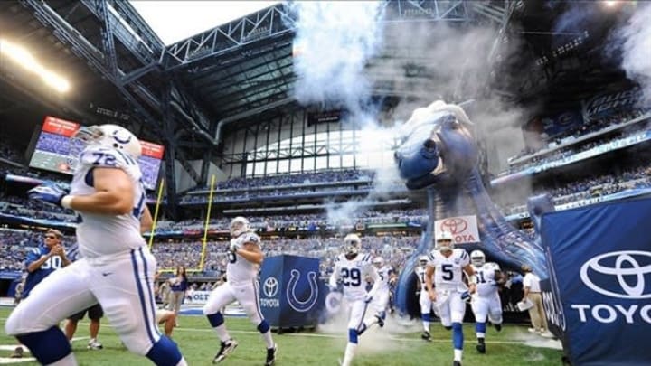 Aug 11, 2013; Indianapolis, IN, USA; The Indianapolis Colts make their entrance into Lucas Oil Stadium before their pre-season game against the Buffalo Bills. Mandatory Credit: Thomas J. Russo-USA TODAY Sports