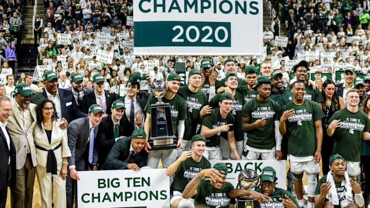 Michigan State poses after beating Ohio State on Sunday, March 8, 2020, at the Breslin Center in East Lansing. The Spartans won a share of the Big Ten Championship.