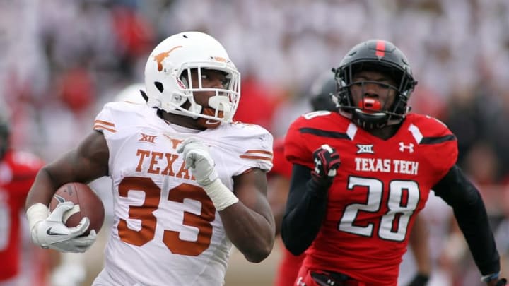 Nov 5, 2016; Lubbock, TX, USA; University of Texas Longhorns running back D’Onta Foreman (33) is chased by Texas Tech Red Raiders defensive back Paul Banks III (28) in the second half at Jones AT&T Stadium. UT defeated Texas Tech 45-37. Mandatory Credit: Michael C. Johnson-USA TODAY Sports