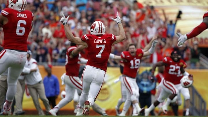Jan 1, 2015; Tampa, FL, USA; Wisconsin Badgers safety Michael Caputo (7) reacts after Auburn Tigers missed the field goal and Wisconsin Badgers won the game in overtime in the 2015 Outback Bowl at Raymond James Stadium. Wisconsin Badgers defeated the Auburn Tigers 34-31 in overtime. Mandatory Credit: Kim Klement-USA TODAY Sports