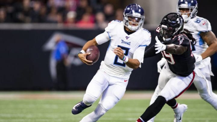 ATLANTA, GA - SEPTEMBER 29: Marcus Mariota #8 of the Tennessee Titans scrambles with the ball during the first half of a game under pressure from De'Vondre Campbell #59 of the Atlanta Falcons at Mercedes-Benz Stadium on September 29, 2019 in Atlanta, Georgia. (Photo by Carmen Mandato/Getty Images)