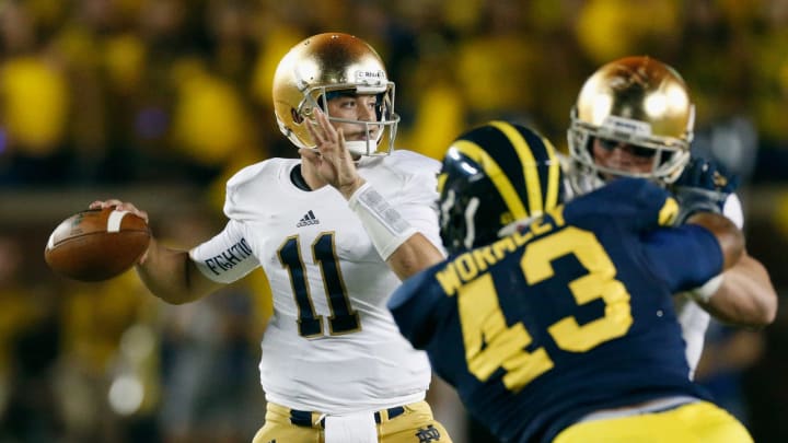ANN ARBOR, MI – SEPTEMBER 07: Tommy Rees #11 of the Notre Dame Fighting Irish passes in the first quarter during the game against the Michigan Wolverines at Michigan Stadium on September 7, 2013 in Ann Arbor, Michigan. (Photo by Gregory Shamus/Getty Images)
