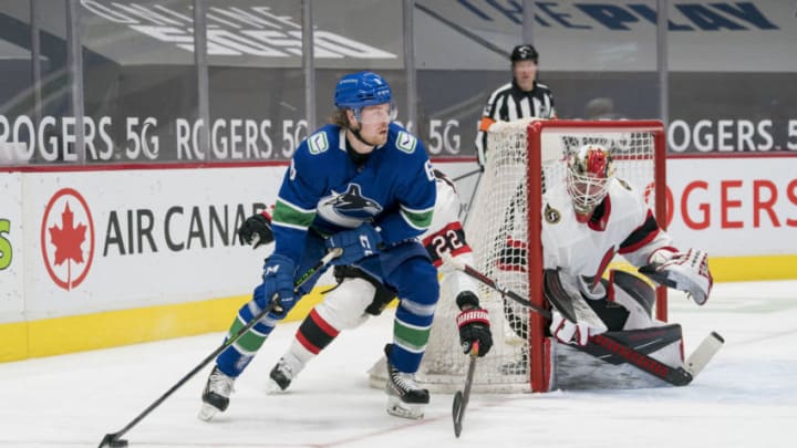 Jan 27, 2021; Vancouver, British Columbia, CAN; Ottawa Senators goalie Marcus Hogberg (1) looks on as defenseman Nikita Zaitsev (22) checks Vancouver Canucks forward Brock Boeser (6)in the third period at Rogers Arena. Vancouver won 5-1. Mandatory Credit: Bob Frid-USA TODAY Sports