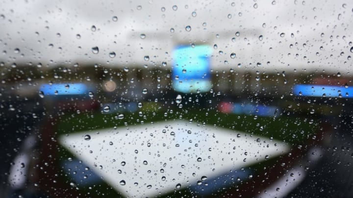 KANSAS CITY, MO - OCTOBER 13: Rain collects on a window in the pressbox over looking the field to postpone Game Three of the American League Championship Series between the Baltimore Orioles and the Kansas City Royals at Kauffman Stadium on October 13, 2014 in Kansas City, Missouri. (Photo by Ed Zurga/Getty Images)