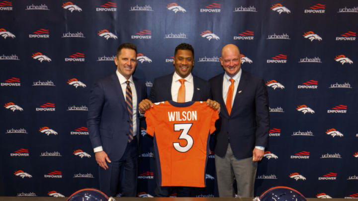 ENGLEWOOD, CO - MARCH 16: Quarterback Russell Wilson #3 of the Denver Broncos poses with his jersey alongside (L) General Manager George Paton and Head Coach Nathaniel Hackett following an introductory press conference at UCHealth Training Center on March 16, 2022 in Englewood, Colorado. (Photo by Justin Edmonds/Getty Images)