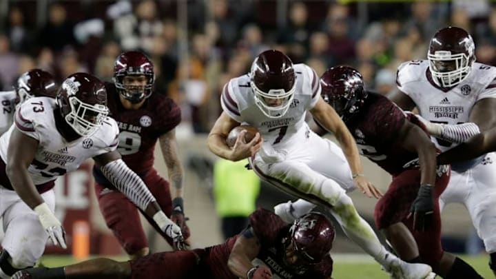 COLLEGE STATION, TX - OCTOBER 28: Nick Fitzgerald #7 of the Mississippi State Bulldogs dives for a first down and is upended by Tyrel Dodson #25 of the Texas A&M Aggies in the third quarter at Kyle Field on October 28, 2017 in College Station, Texas. (Photo by Tim Warner/Getty Images)
