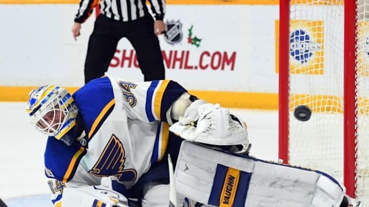 Dec 13, 2016; Nashville, TN, USA; St. Louis Blues goalie Jake Allen (34) makes a save during the third period against the Nashville Predators at Bridgestone Arena. Mandatory Credit: Christopher Hanewinckel-USA TODAY Sports