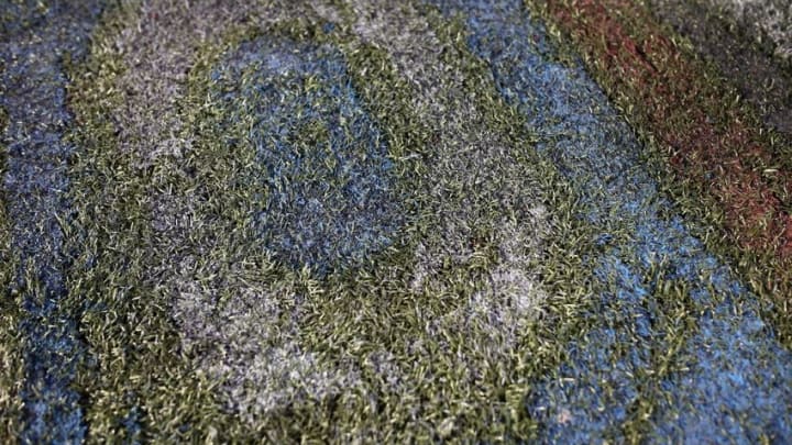 Aug 7, 2016; Canton, OH, USA; A detailed view of the remains of the Hall of Fame logo on the field after the 2016 Hall of Fame Game at Tom Benson Hall of Fame Stadium. The game was cancelled due to safety concerns with the condition of the playing surface. Mandatory Credit: Aaron Doster-USA TODAY Sports