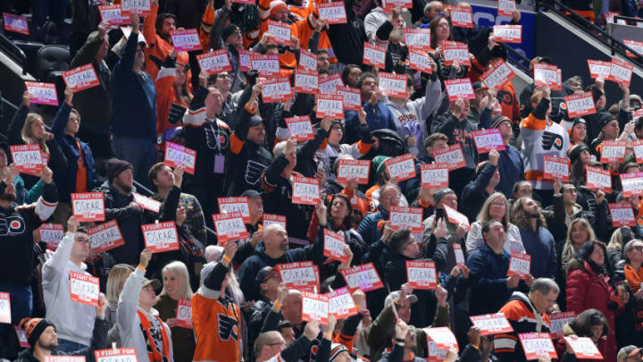 PHILADELPHIA, PA - DECEMBER 17: Fans hold up signs in support of Oskar Lindblom #23 of the Philadelphia Flyers who was recently diagnosed with Ewing sarcoma, a rare form of bone cancer, during a stoppage in play in the first period against the Anaheim Ducks on December 17, 2019 at the Wells Fargo Center in Philadelphia, Pennsylvania. (Photo by Drew Hallowell/Getty Images)